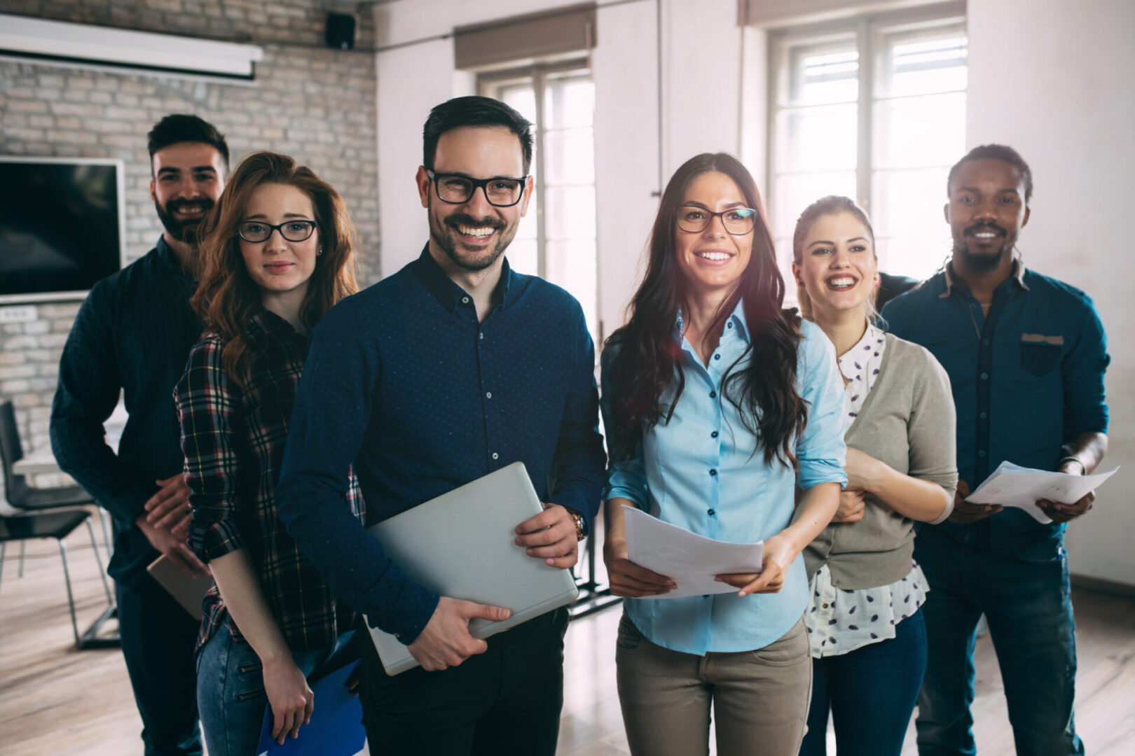 A group of people standing in front of each other.